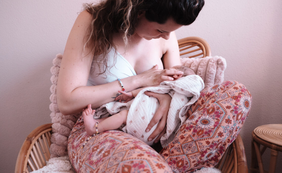 Portfolio building photo of new mother breastfeeding